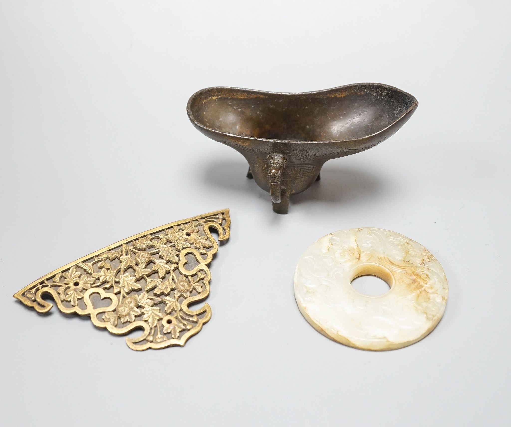 A Chinese white and brown jade bi disc, a Japanese bronze mount and a Chinese archaistic bronze vessel